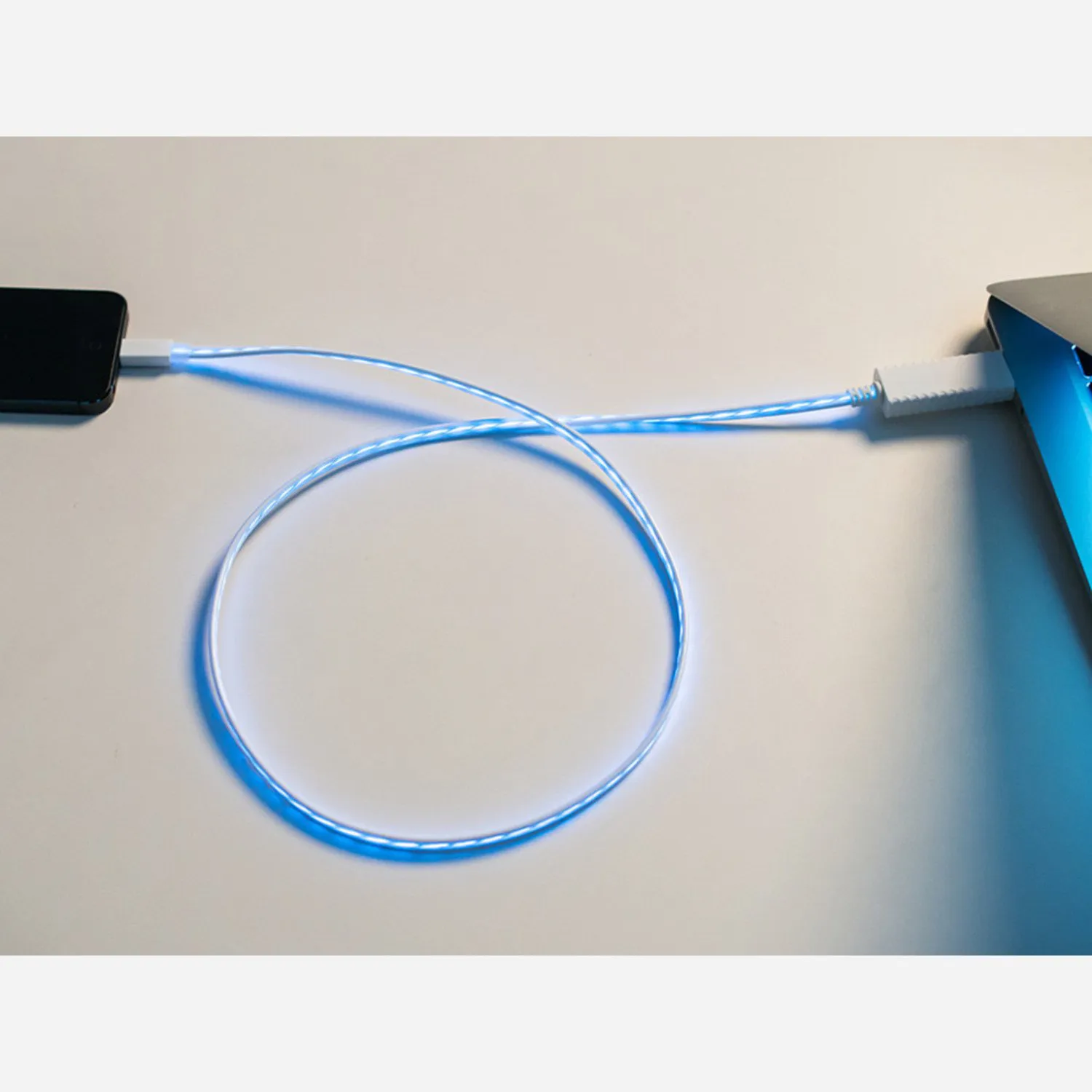 Photo of Flowing Effect iOS Lightning Cable - White w/Aqua EL