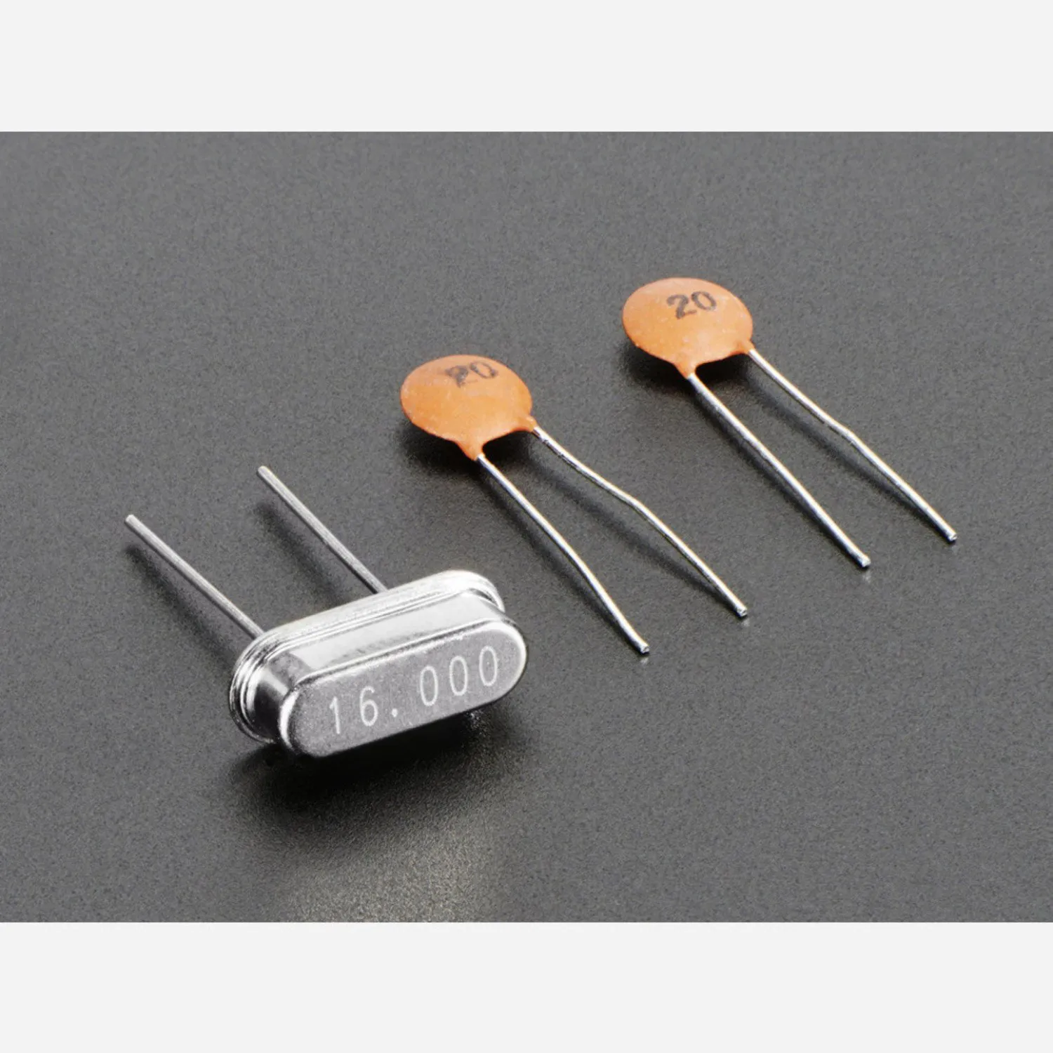 Photo of 16 MHz Crystal + 20pF capacitors