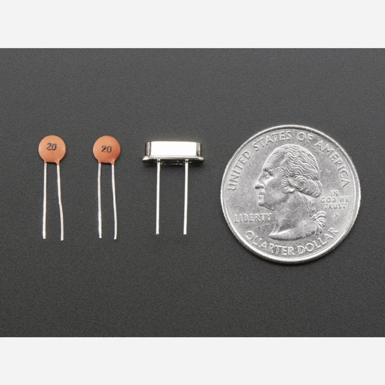 Photo of 4 MHz Crystal + 20pF capacitors